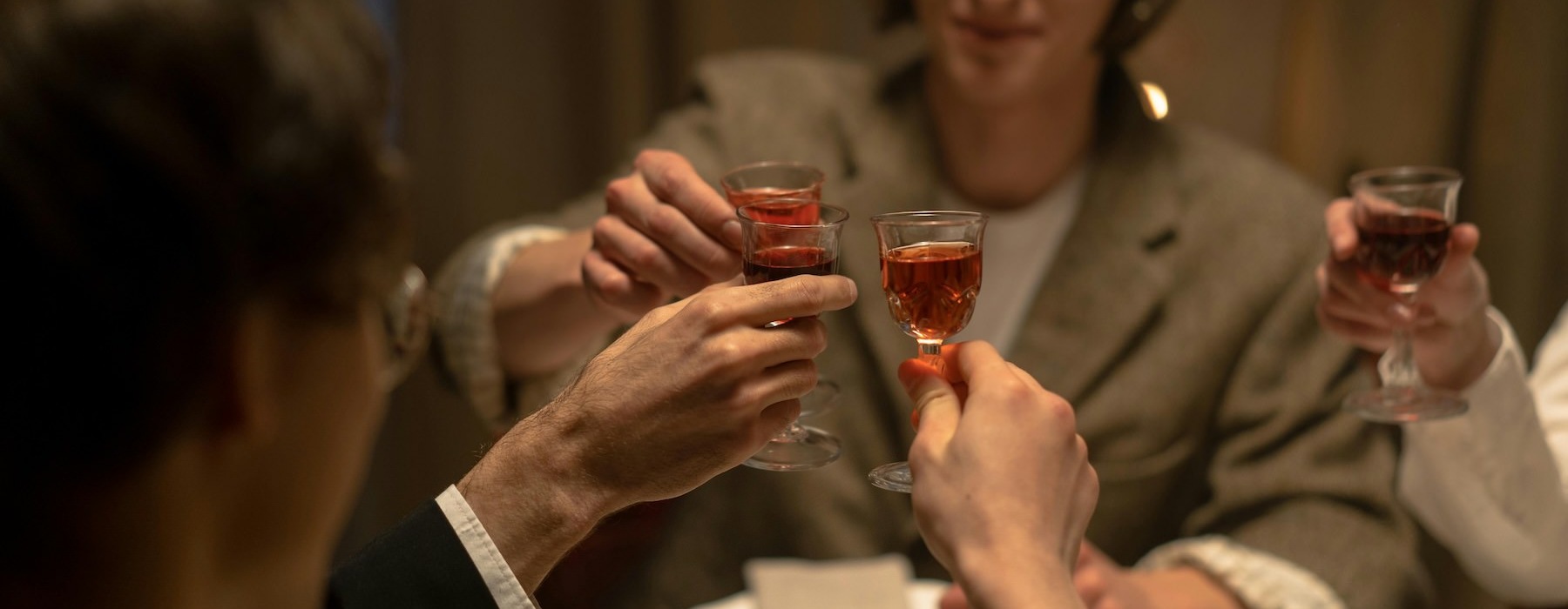 a group of people sharing drinks