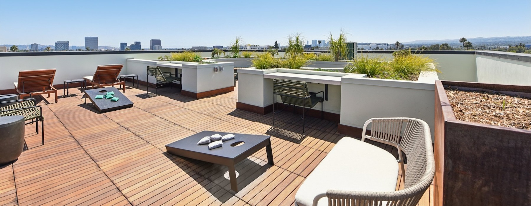 a deck with chairs and a table