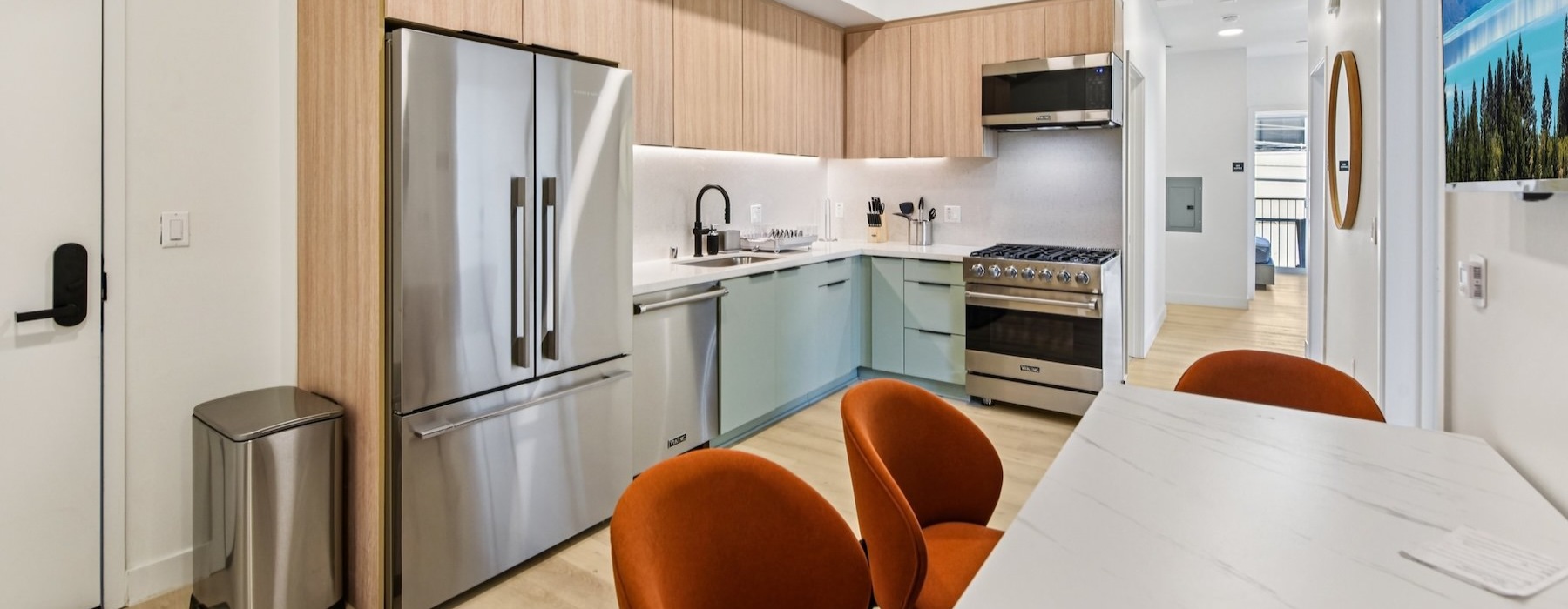 a kitchen with a table and chairs