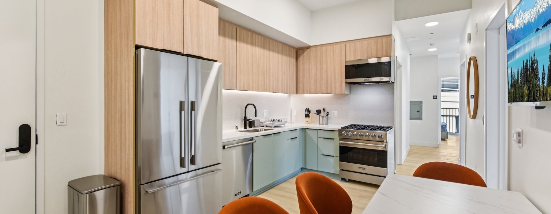 a kitchen with a table and chairs