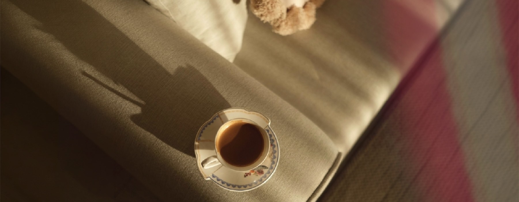 a cup of coffee on a couch