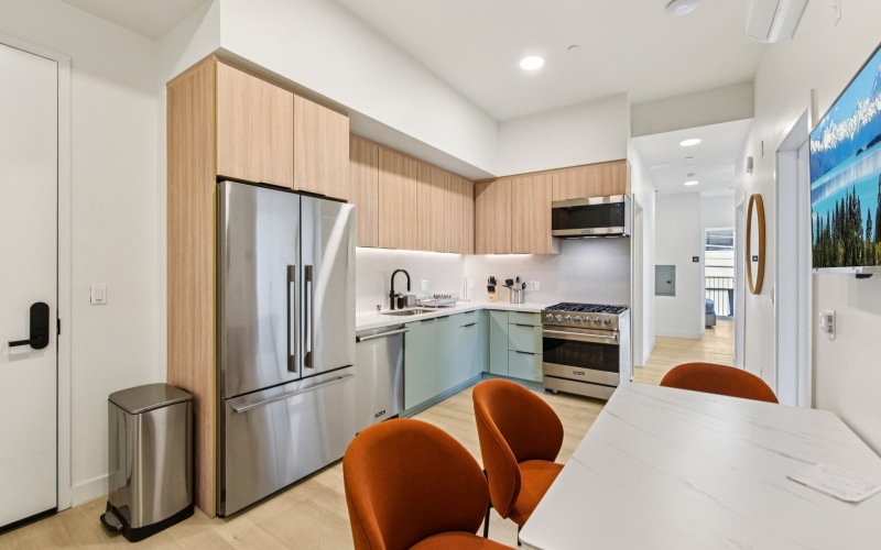 a kitchen with wood cabients